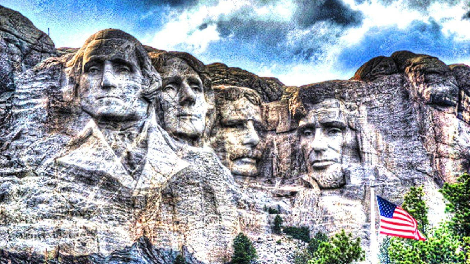 Mount Rushmore With American Flag On Pole Wallpaper