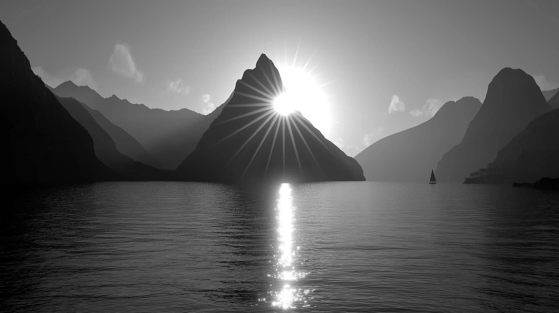 Mountain Peak With Sunrays Reflected On Tranquil Water Wallpaper