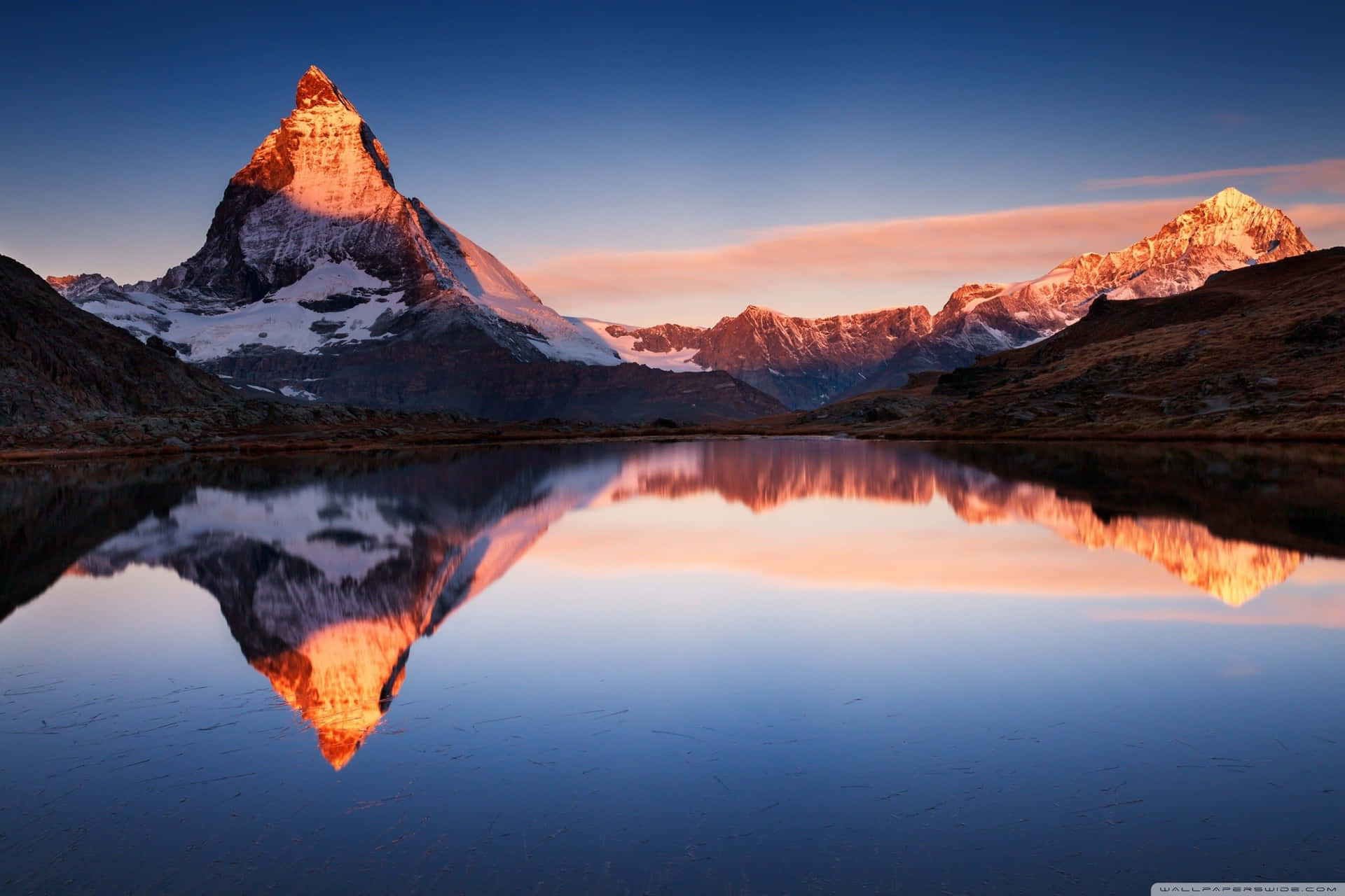 Mountain Reflection On Superficial Lake Water Wallpaper