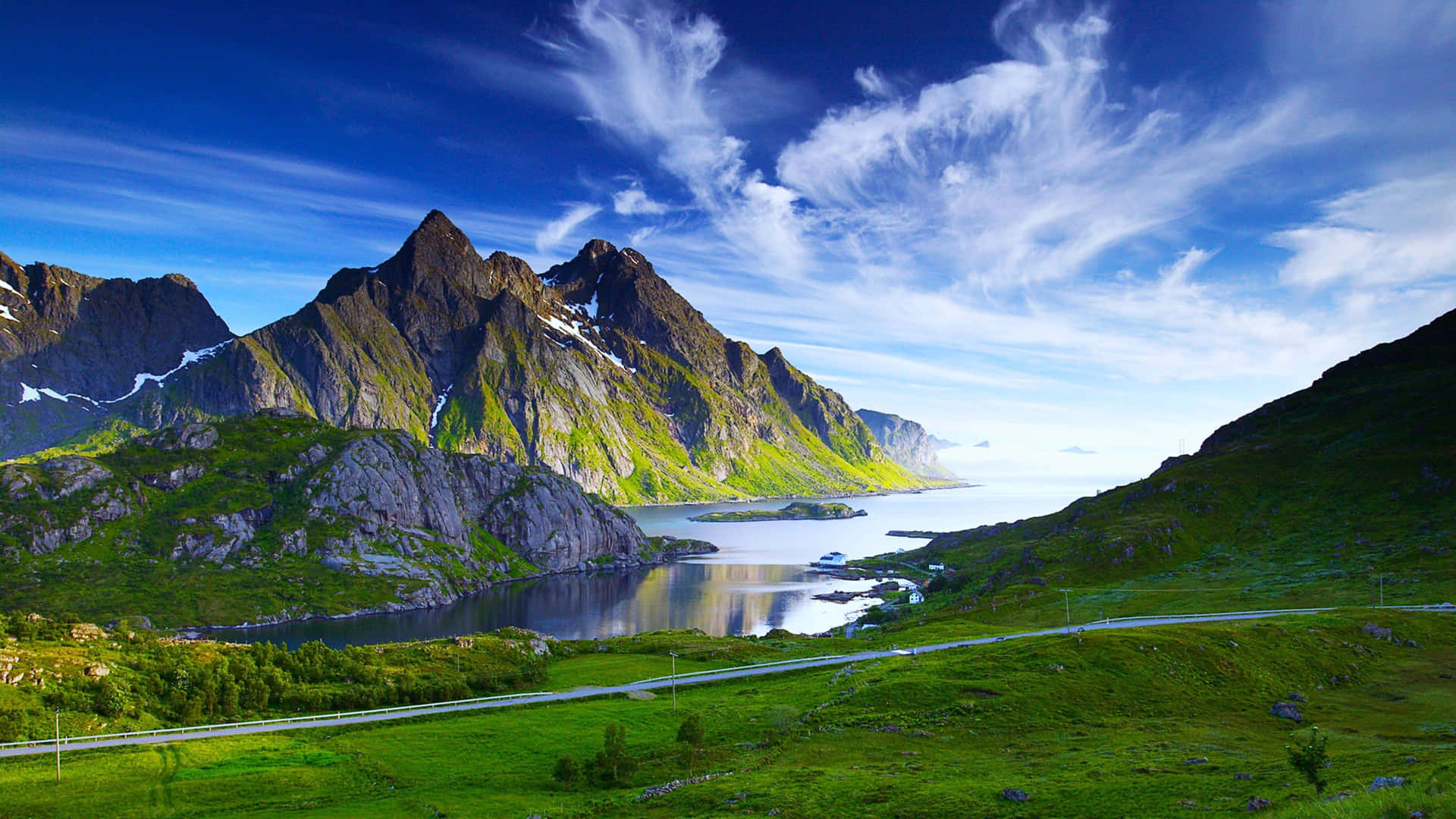 “A mesmerizing landscape of rugged mountains and lush greenery.” Wallpaper