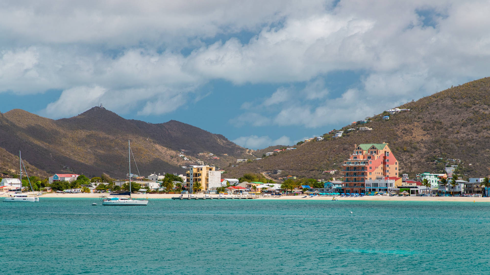 Mountains Fronting The Beach In Sint Maarten Wallpaper