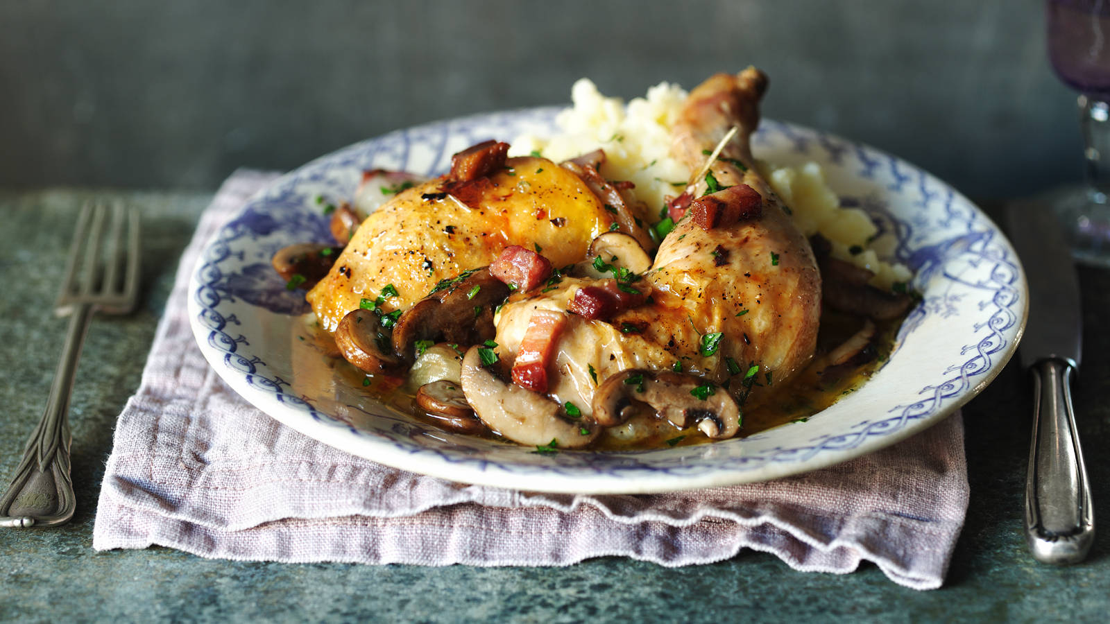 Mouthwatering Coq Au Vin On A Ceramic Plate Wallpaper