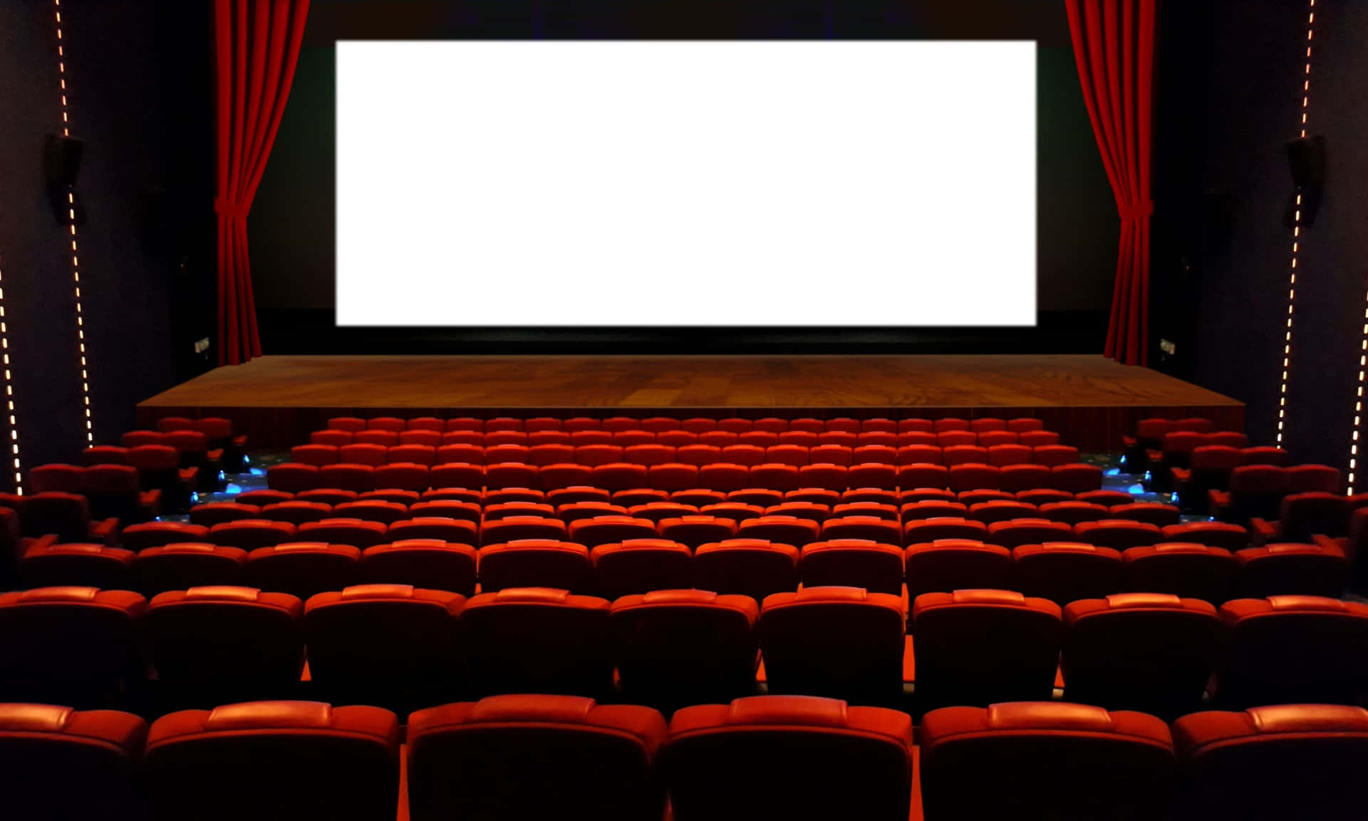 A Cinema With Red Seats And A Blank Screen Wallpaper