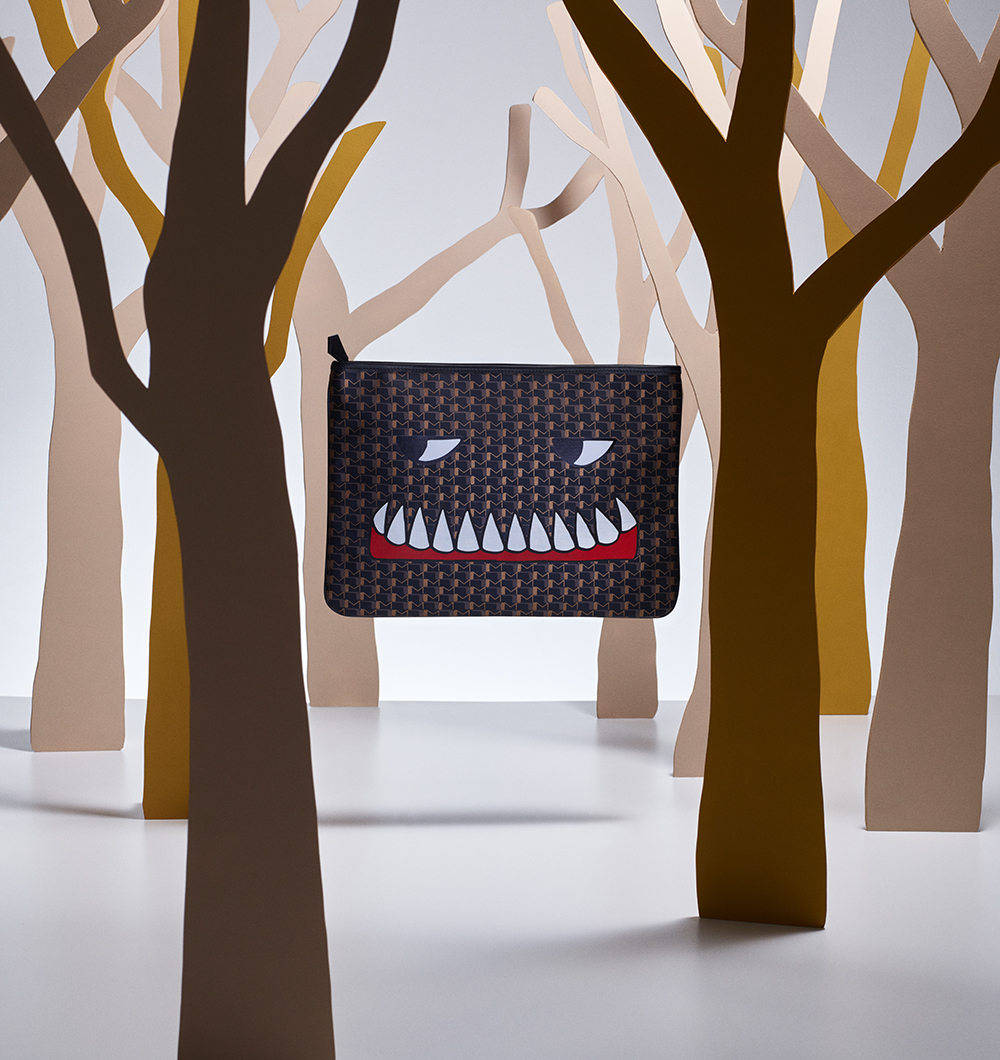 Indulge in Luxury with Moynat's Bad Dreams Clutch Wallpaper