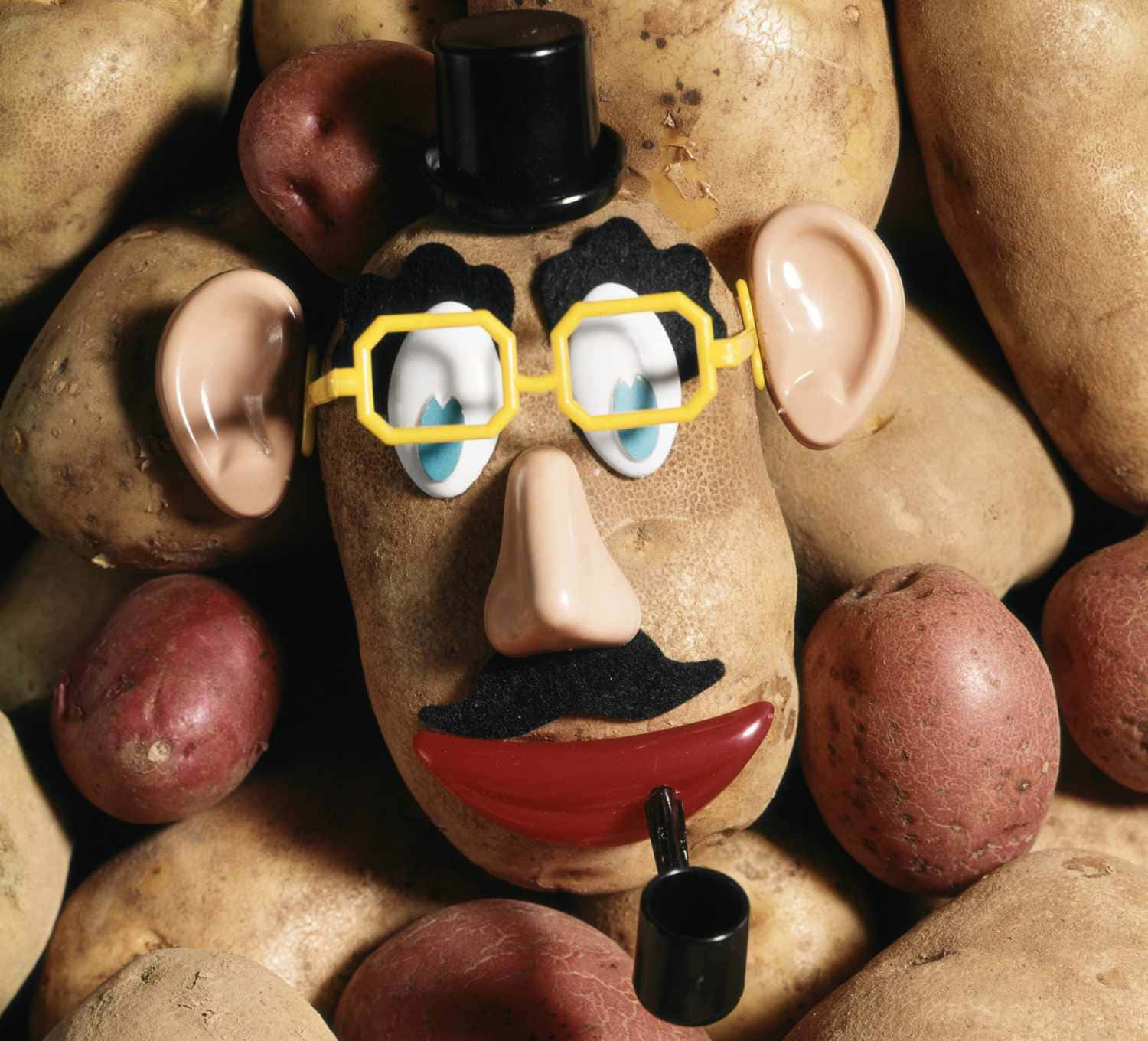 A Potato Head With Glasses And A Pipe