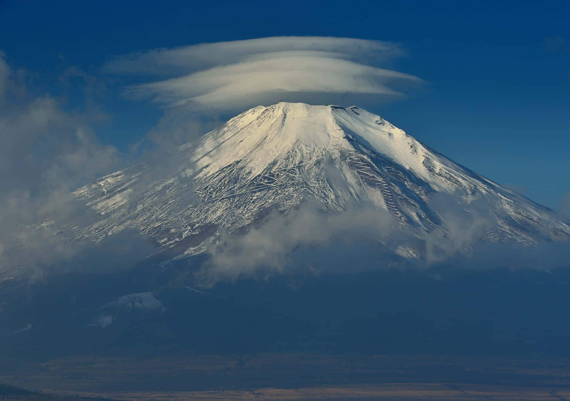 A Cloud Is Seen On Top Of A Mountain