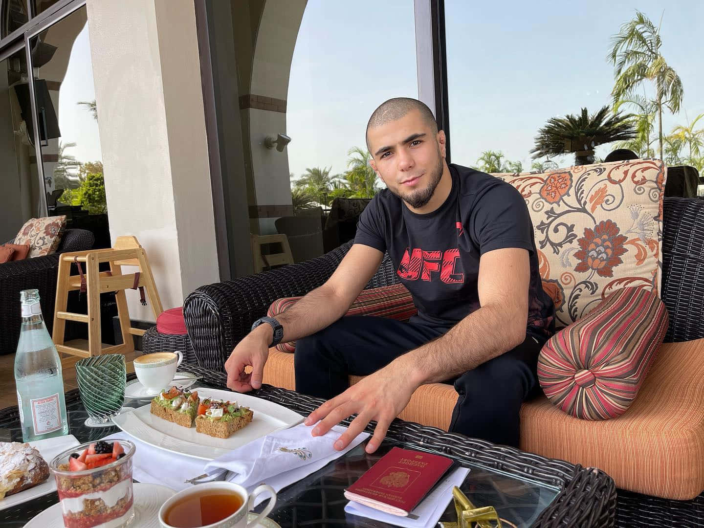 Muhammad Mokaev Eating On Couch Wallpaper