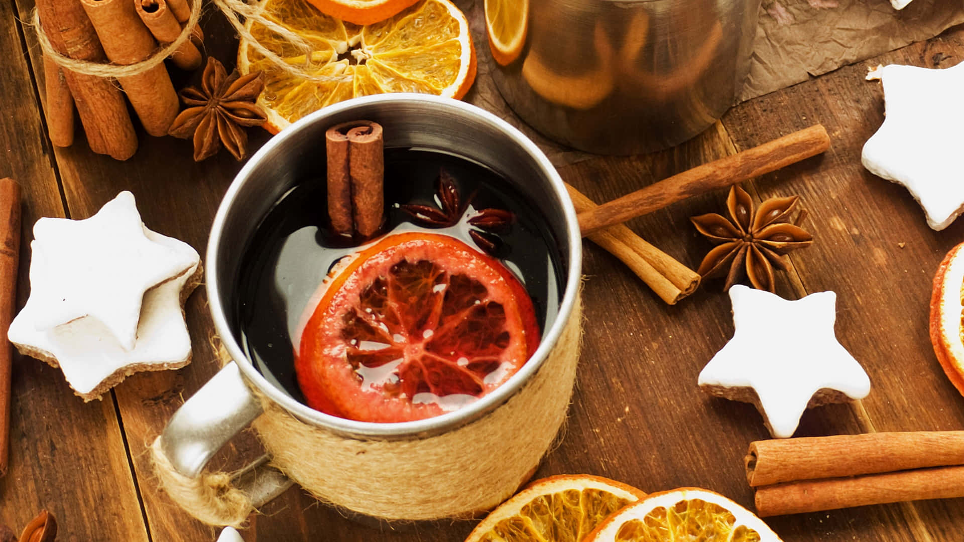 Warm and inviting mulled wine in a cozy setting Wallpaper