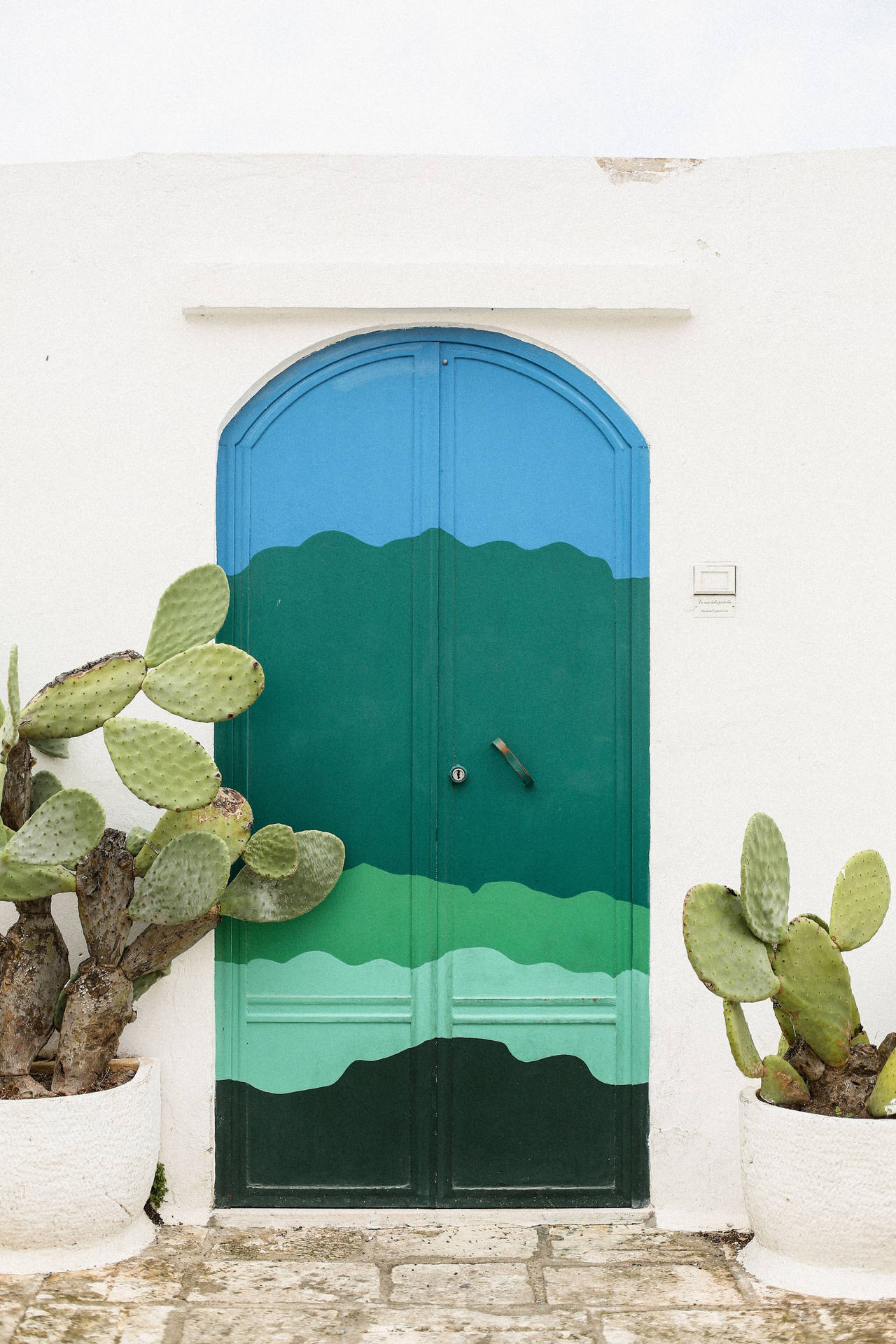 Multicolored Wooden Door In Ostuni Wallpaper