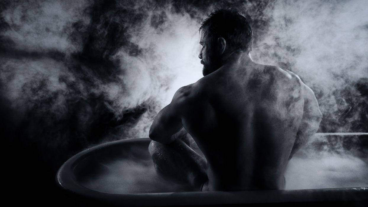 Muscle Man Bathing In A Tub Wallpaper