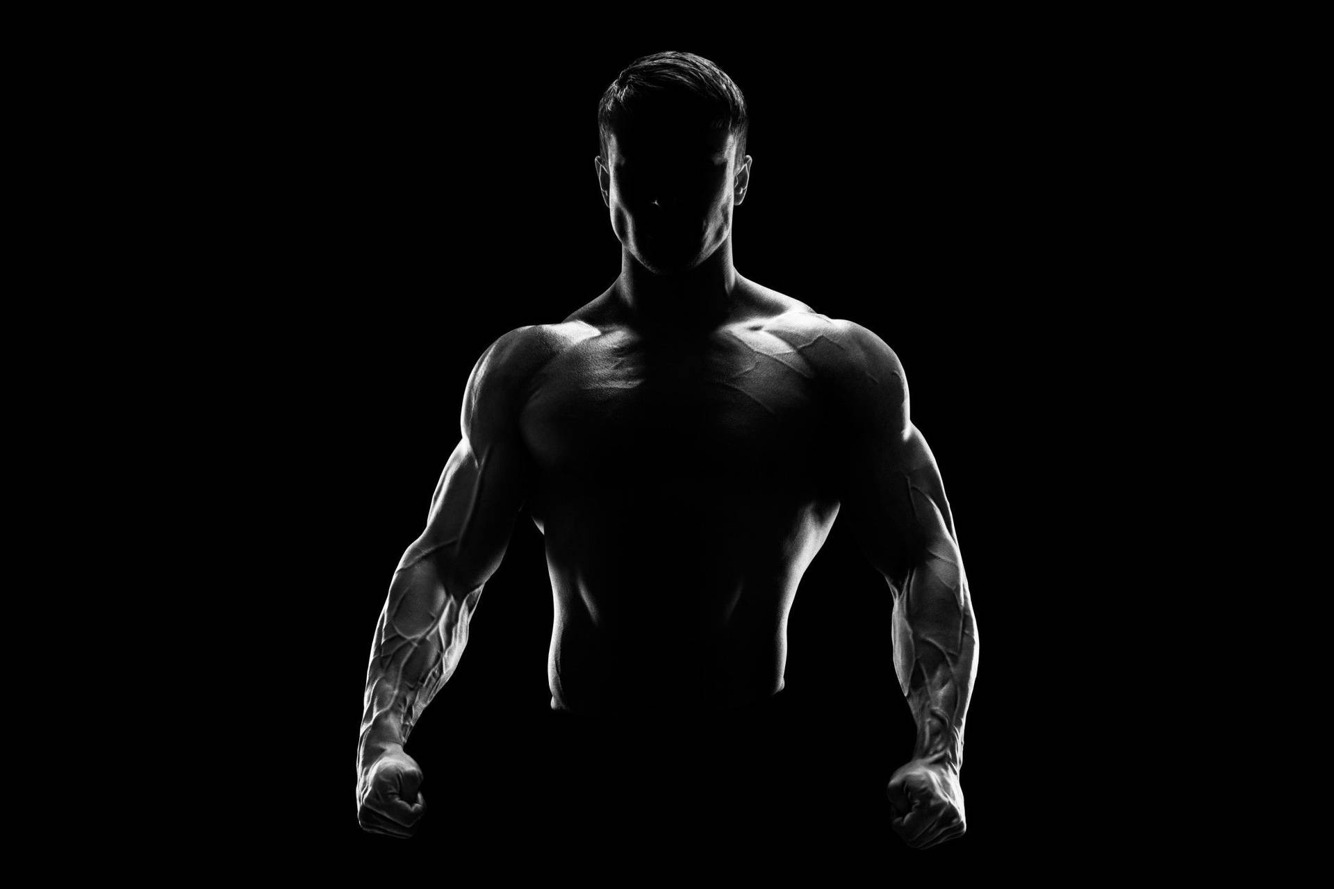 Muscle Man Silhouette In The Dark Wallpaper