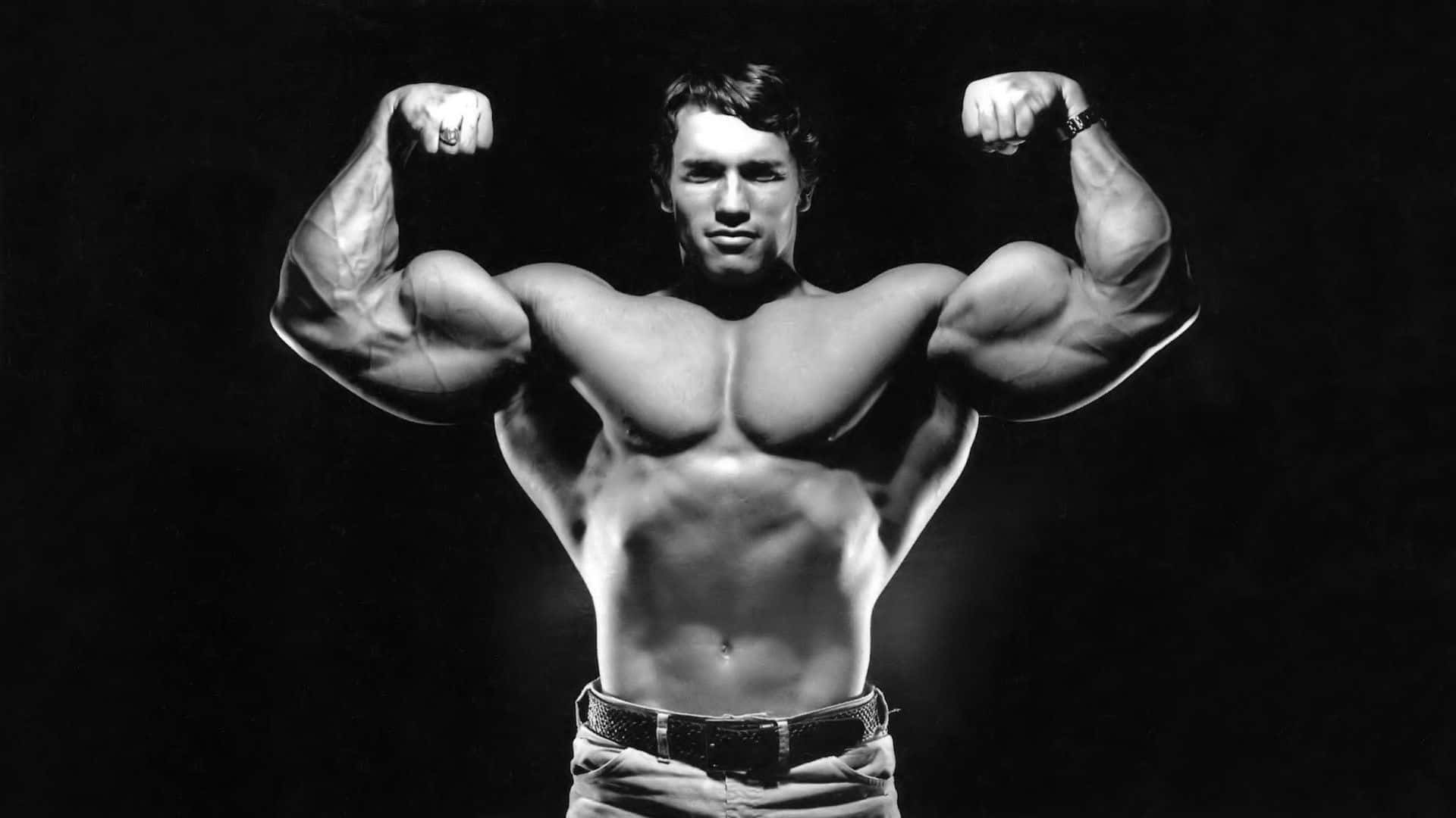 Muscular Man Double Biceps Pose Wallpaper
