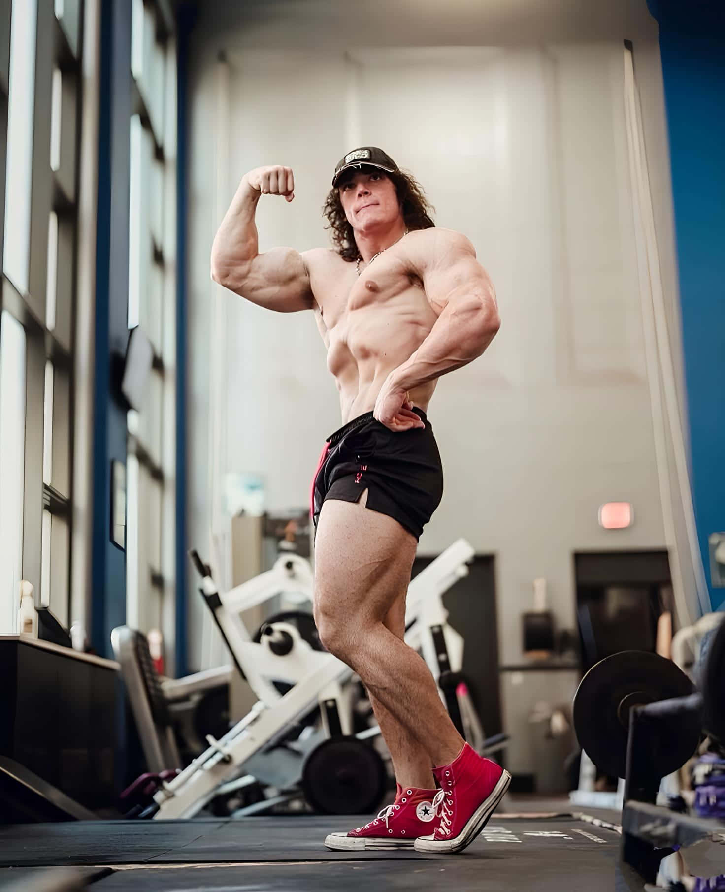 Muscular Man Flexingin Gym Wallpaper