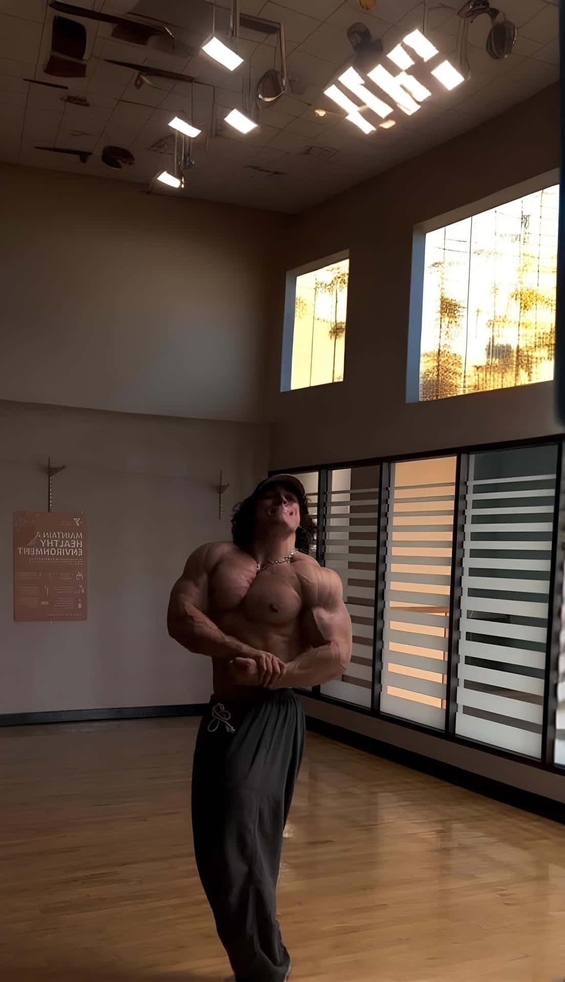Muscular Man Indoor Workout Wallpaper