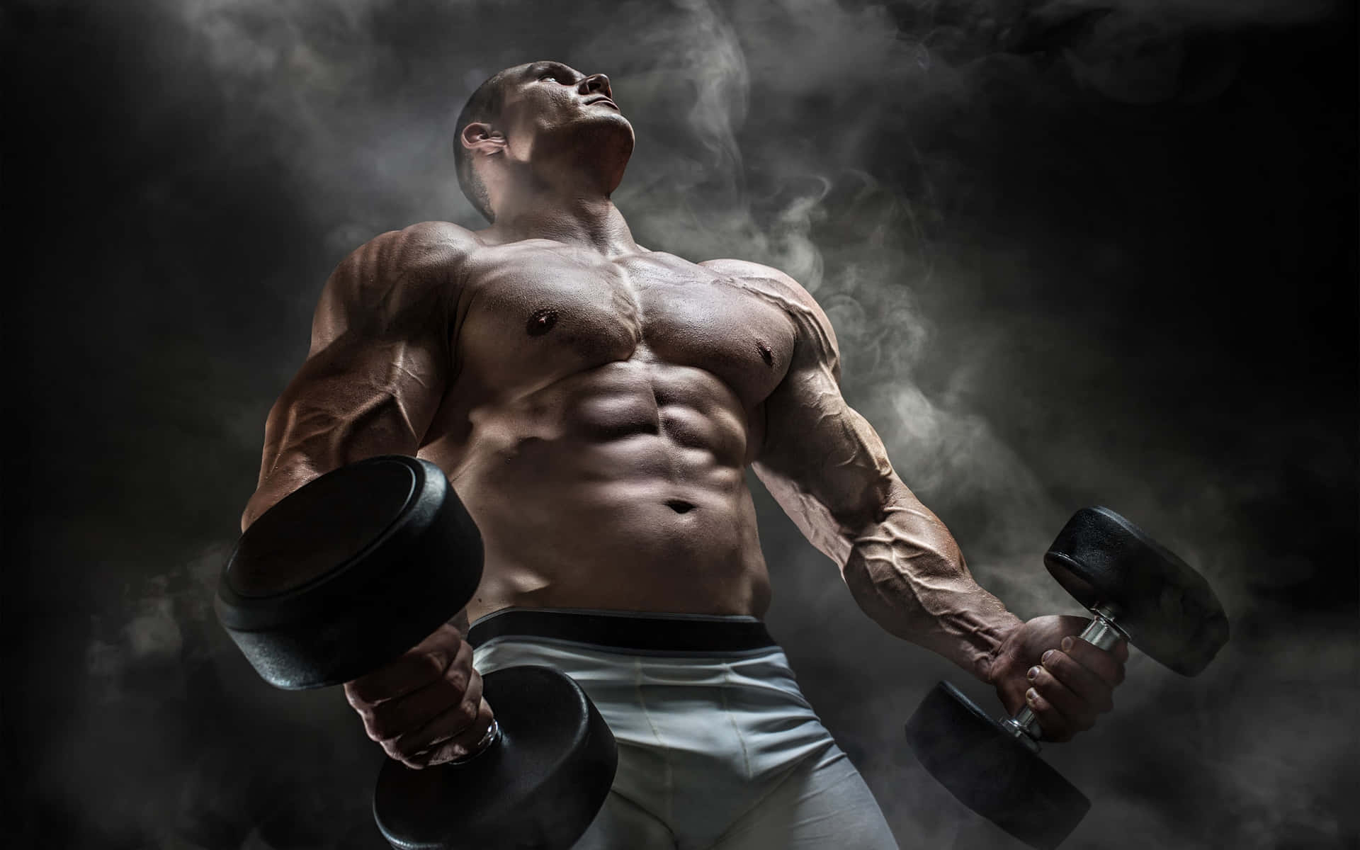 Muscular Man Lifting Dumbbells Wallpaper