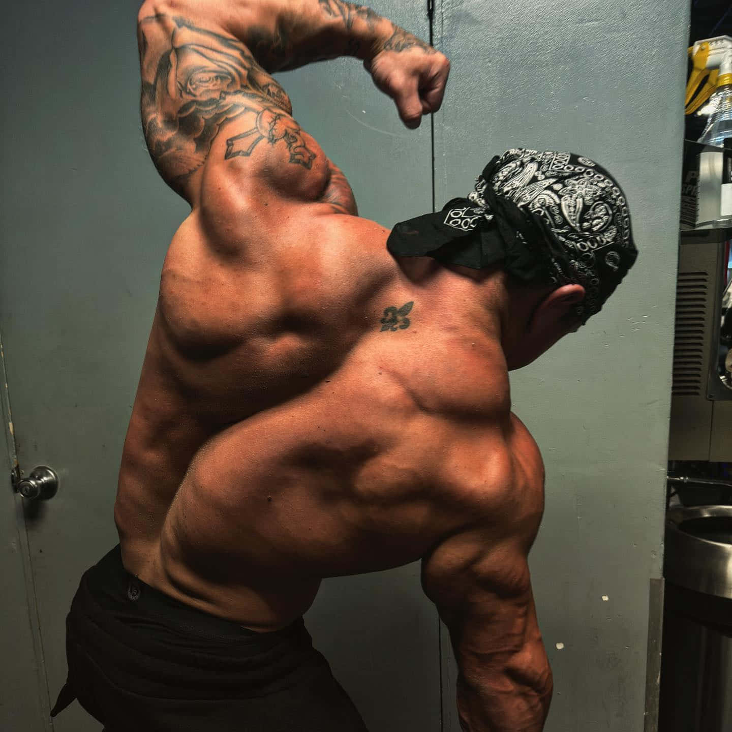 Muscular Man Showing Off Biceps Wallpaper