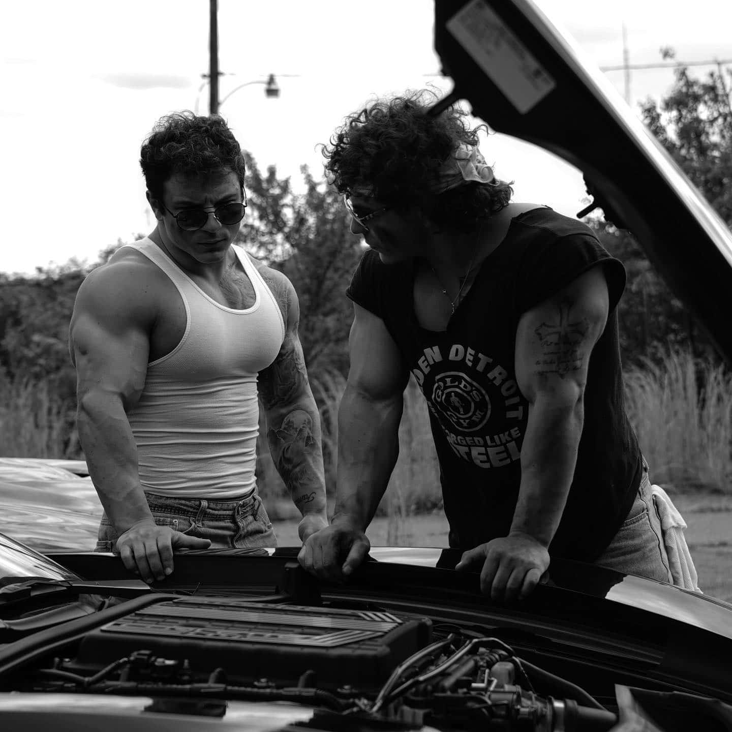 Muscular Twins Checking Car Engine Wallpaper
