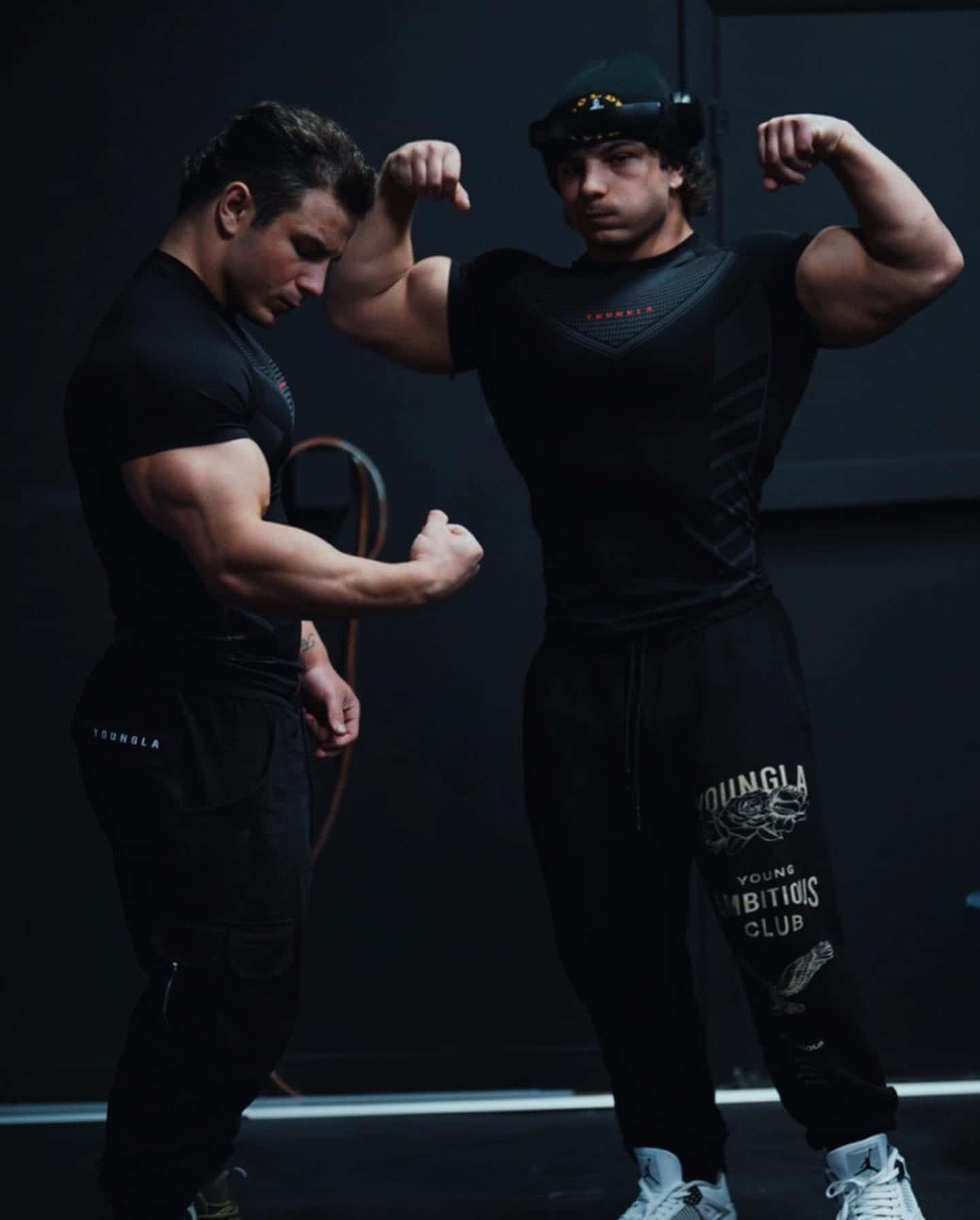 Muscular Twins Flexing Biceps.jpg Wallpaper