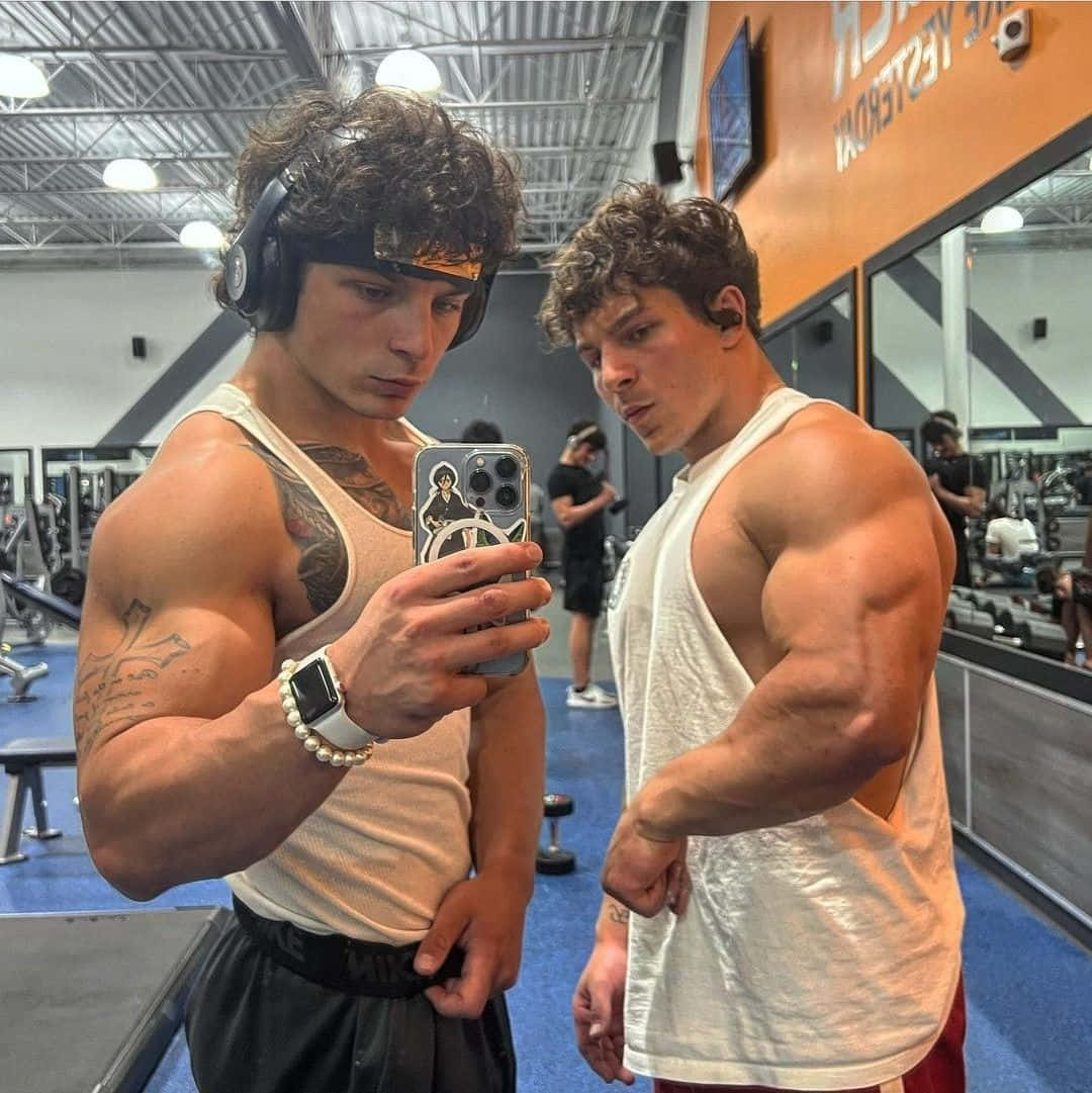 Download Muscular Twins Gym Selfie Wallpaper | Wallpapers.com