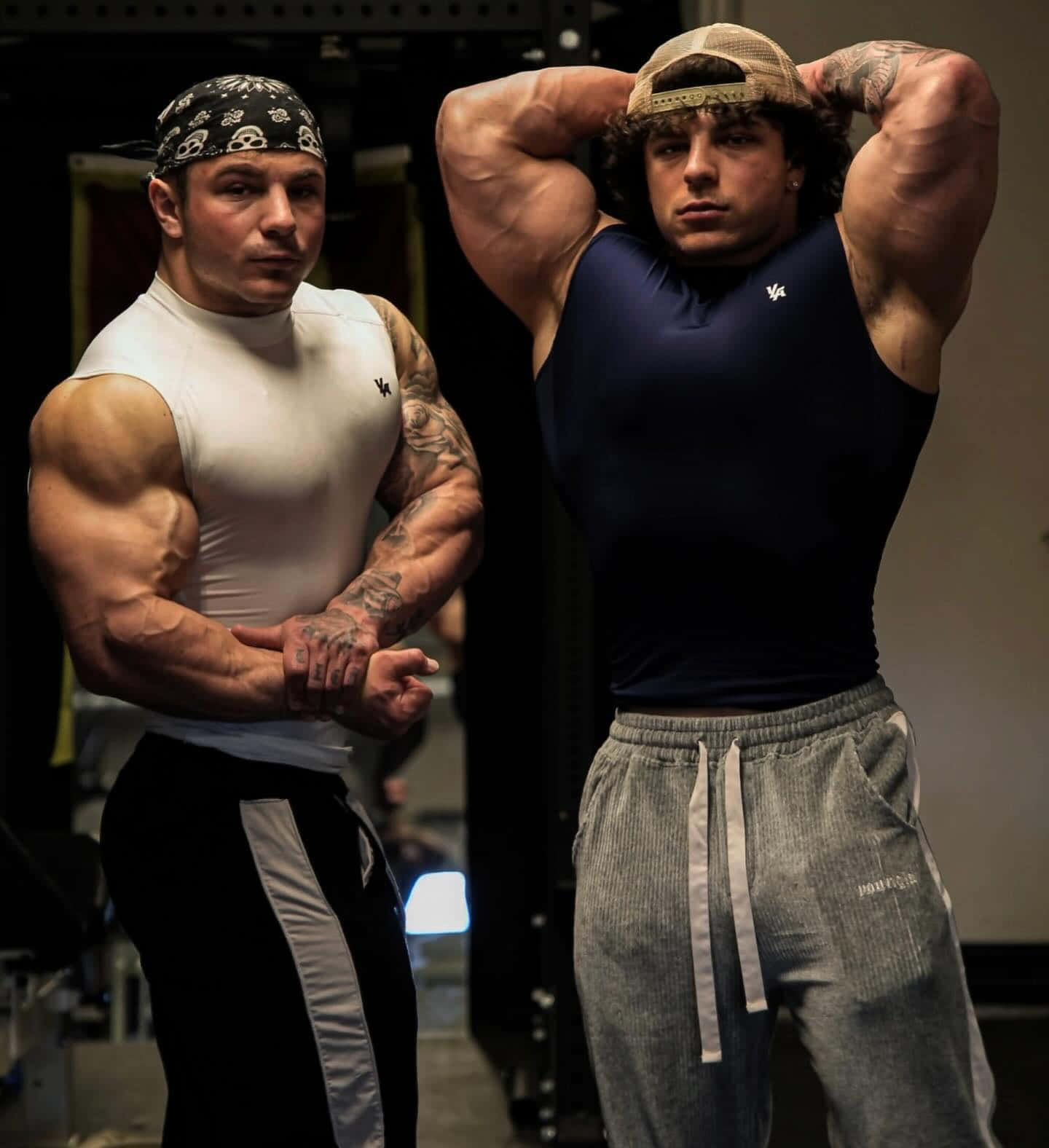 Muscular Twins Posingin Gym Wallpaper