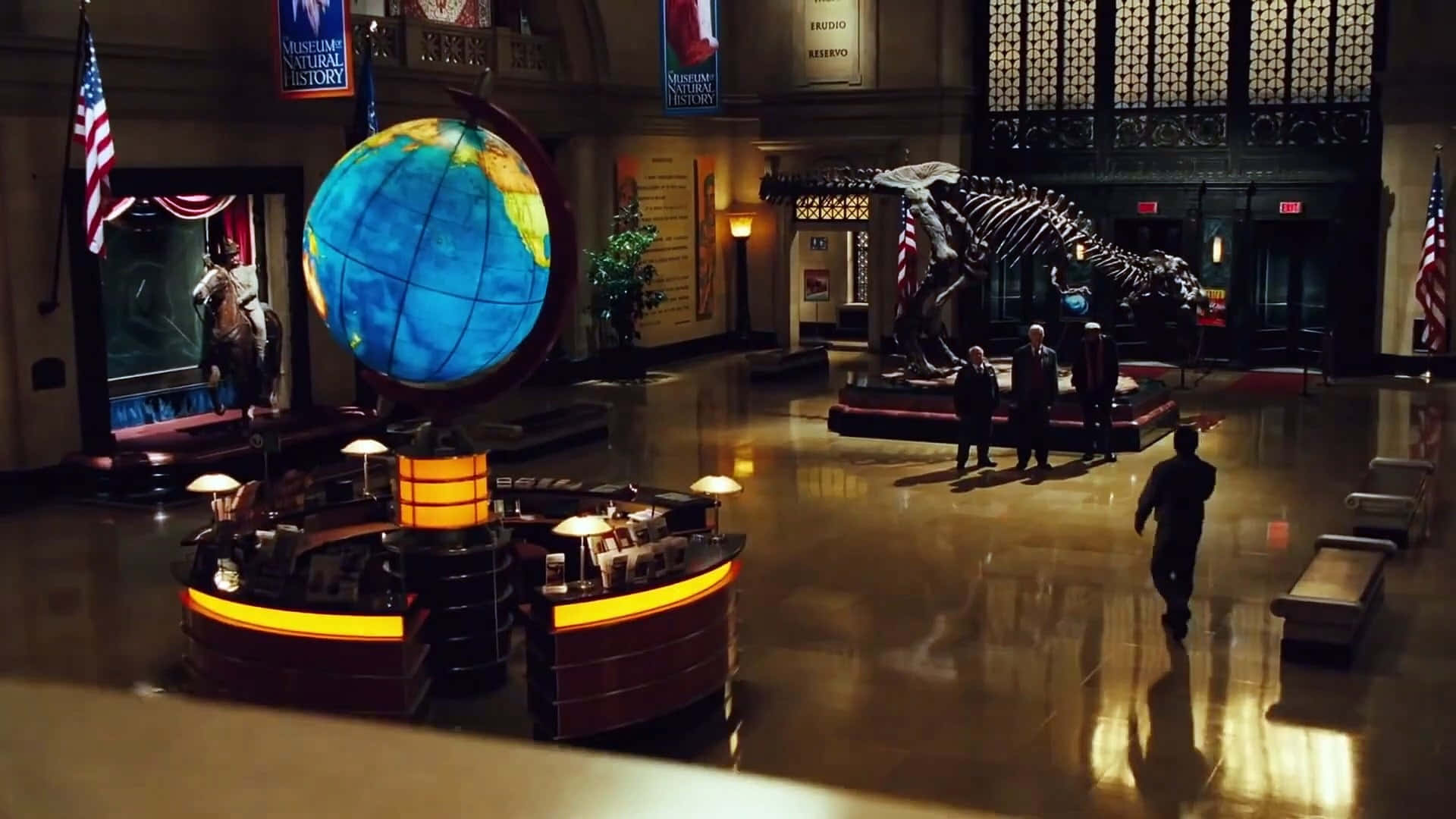 A Museum With A Large Globe And A Dinosaur Skeleton