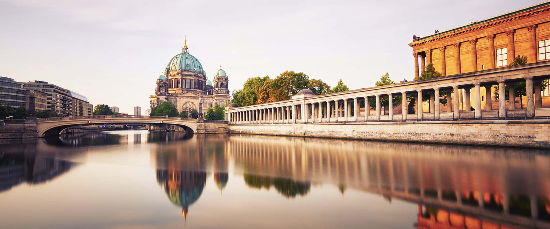Museum Island Surrounded By Calm Water Background