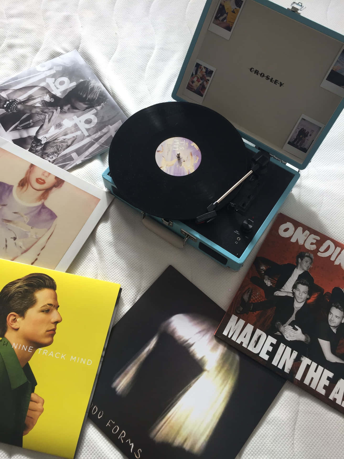 A Suitcase With A Record Player And A Few Cds