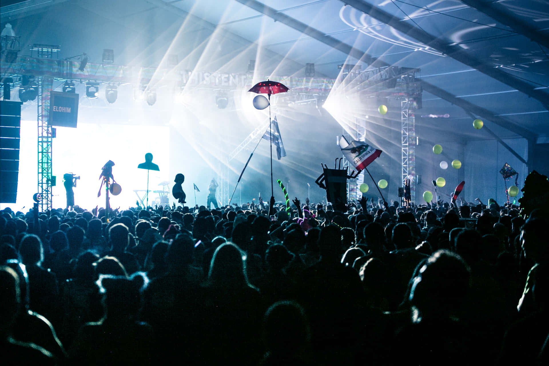Energetic Crowd at Music Festival Wallpaper