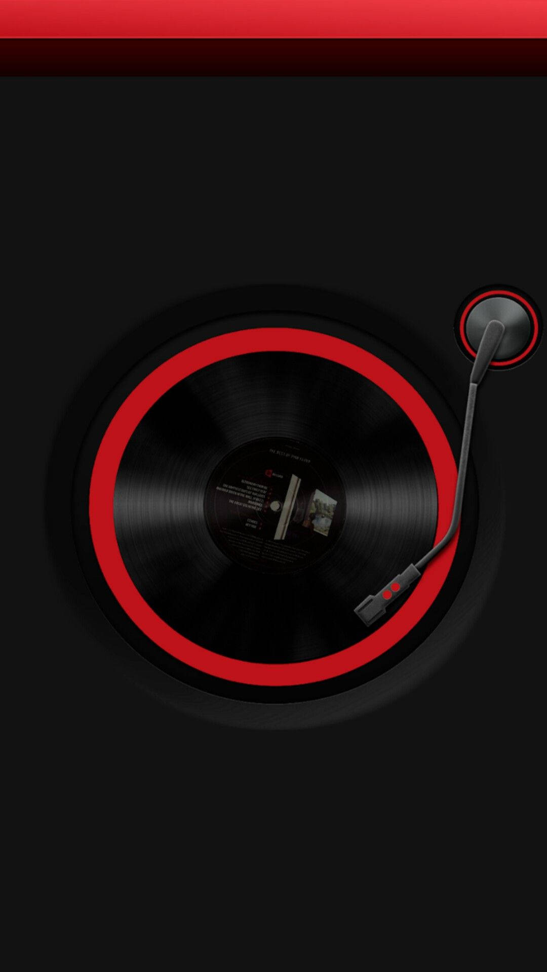 Caption: A Vinyl Record Spinning on a Music Phone Turntable Wallpaper