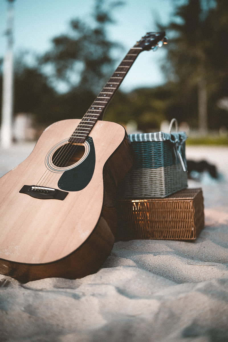 Musikinstrument guitar på strand baggrundsbillede Wallpaper