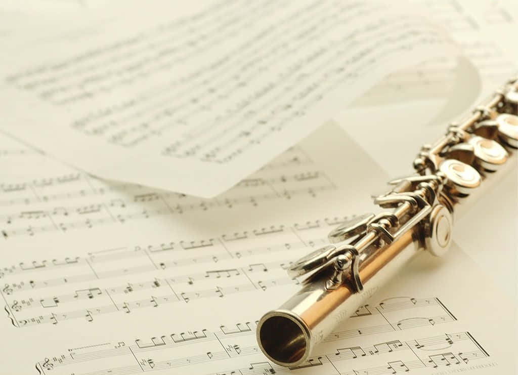 Imagende Un Instrumento Musical Flauta Sobre Partituras De Música.