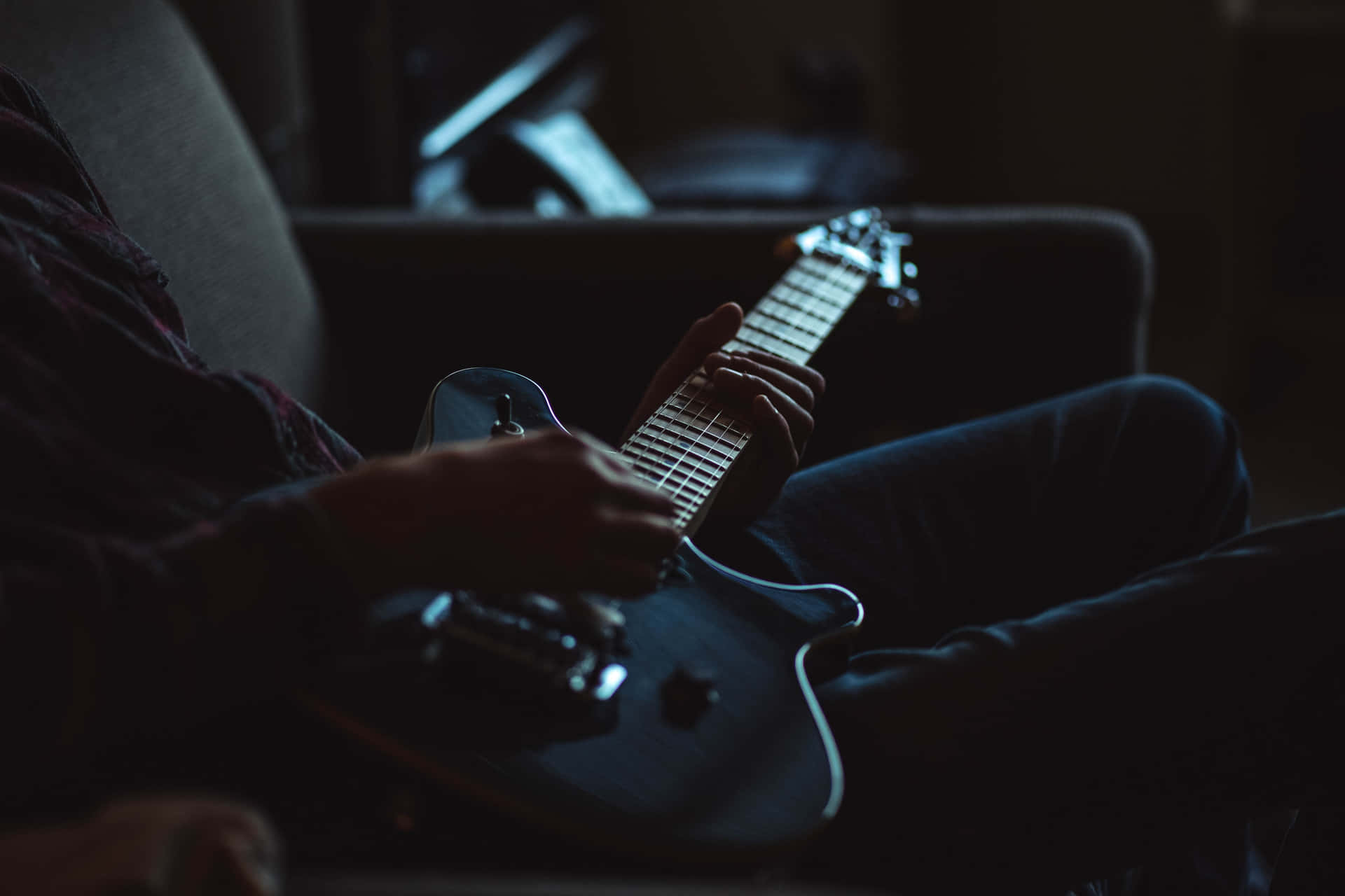 Man Sitting Holding Musical Instrument Guitar Picture