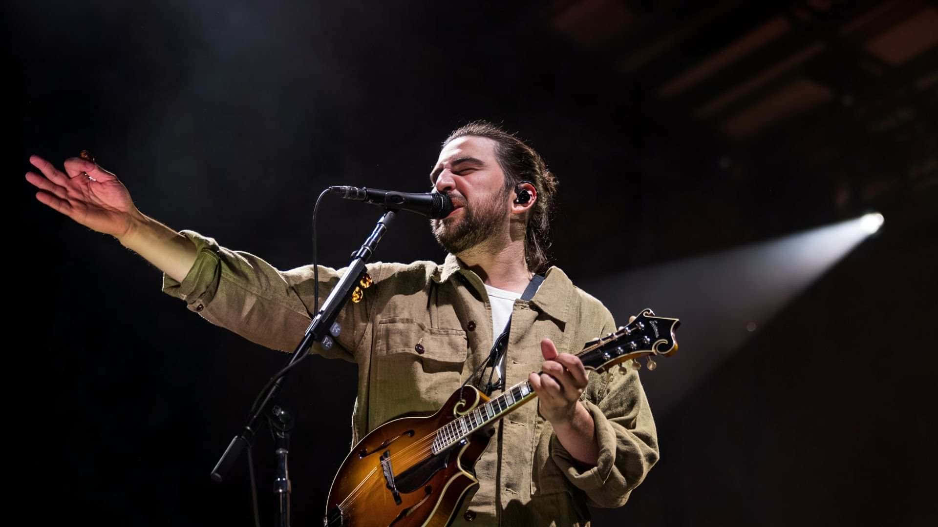 Musician Performing Livewith Mandolin Wallpaper