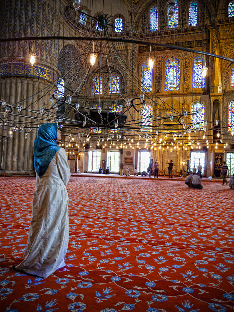 Muslim Woman Inside The Blue Mosque Wallpaper