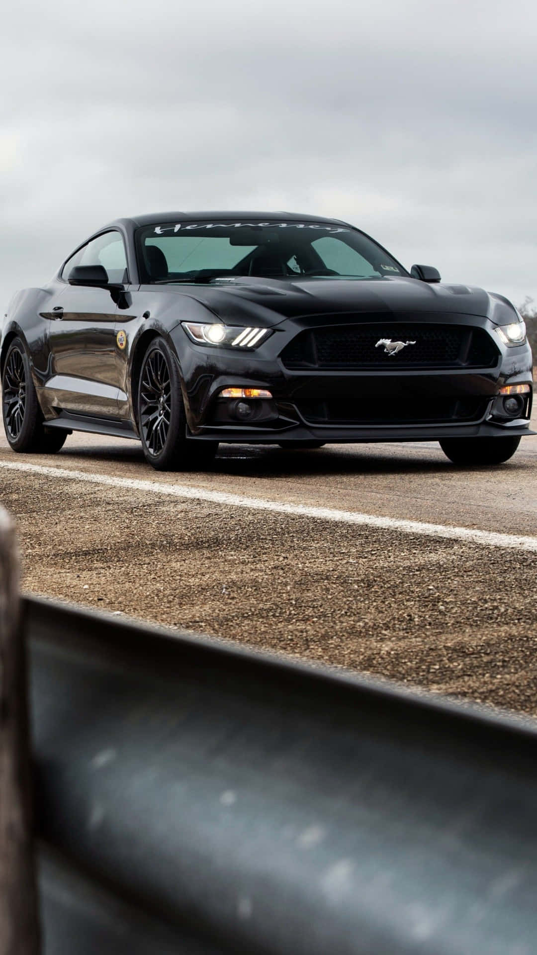 Get behind the wheel of your dream car with the Mustang iPhone Wallpaper