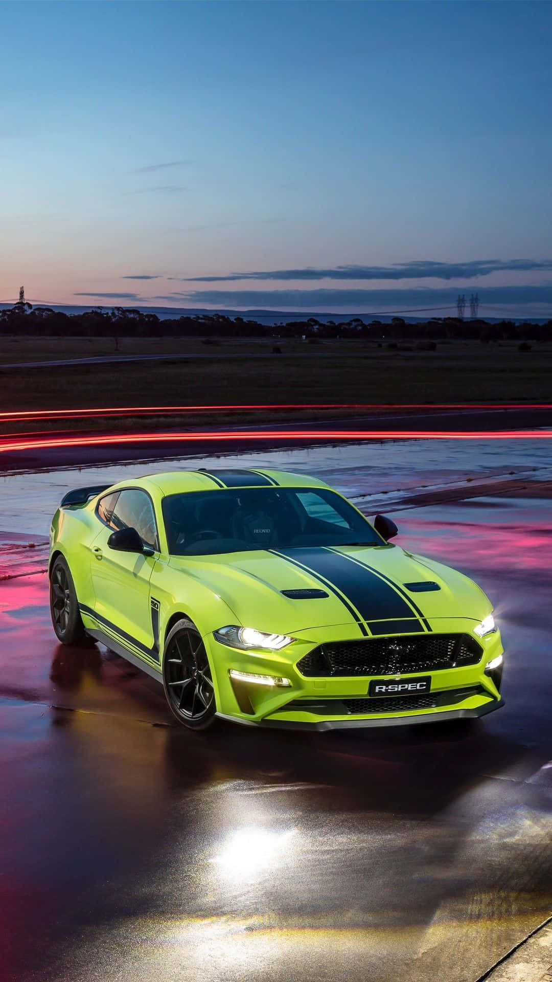 The 2019 Ford Mustang Gt Is Driving On A Wet Road Wallpaper