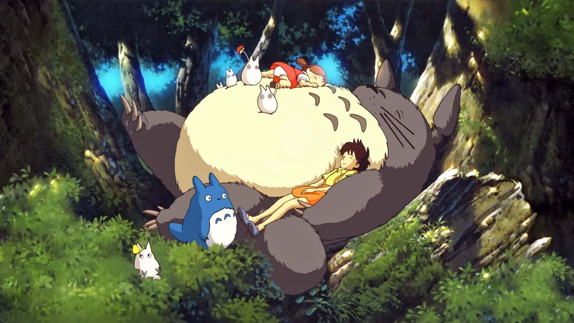 Caption: My Neighbor Totoro alongside friends in a whimsical forest setting Wallpaper