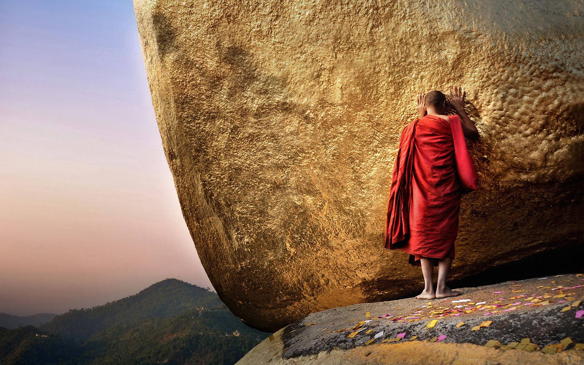 Myanmar Monk With Big Rock Wallpaper