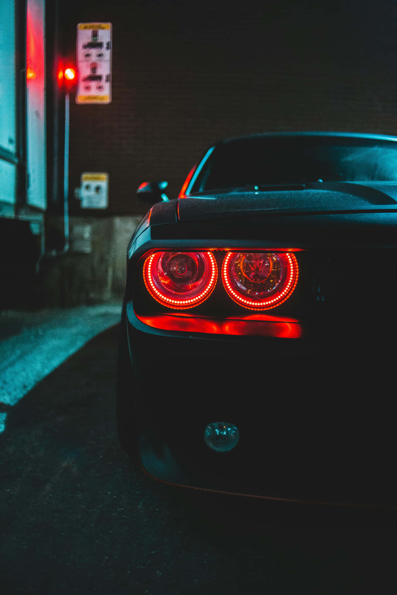 Mysterious Black Car Red Tail Lights Night Wallpaper