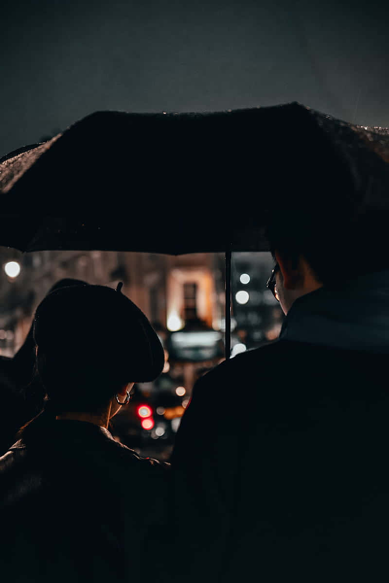 Mysterious Couple Under Umbrella Wallpaper