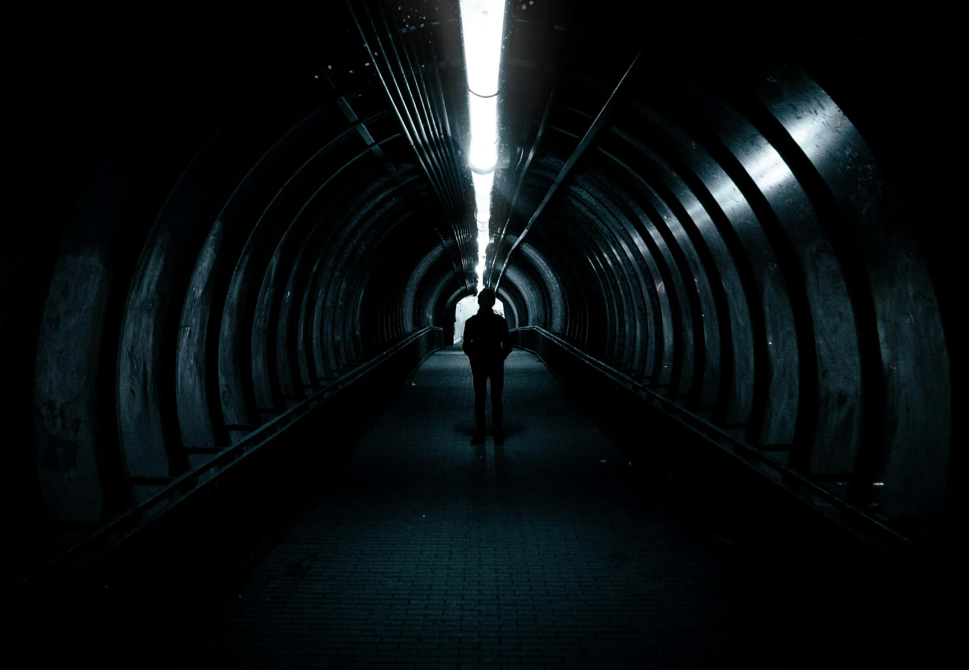 Mysterious Figurein Dark Tunnel.jpg Wallpaper