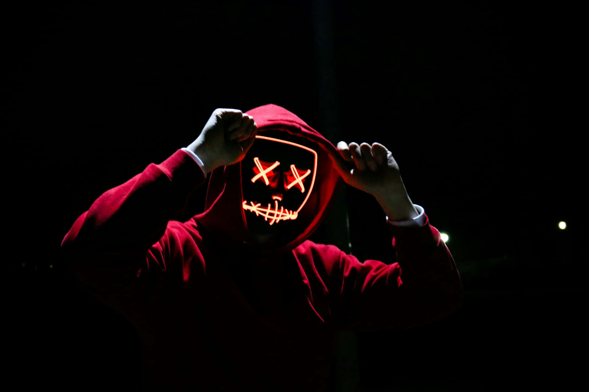 Mysterious Hooded Figurewith Neon Mask4k.jpg Wallpaper