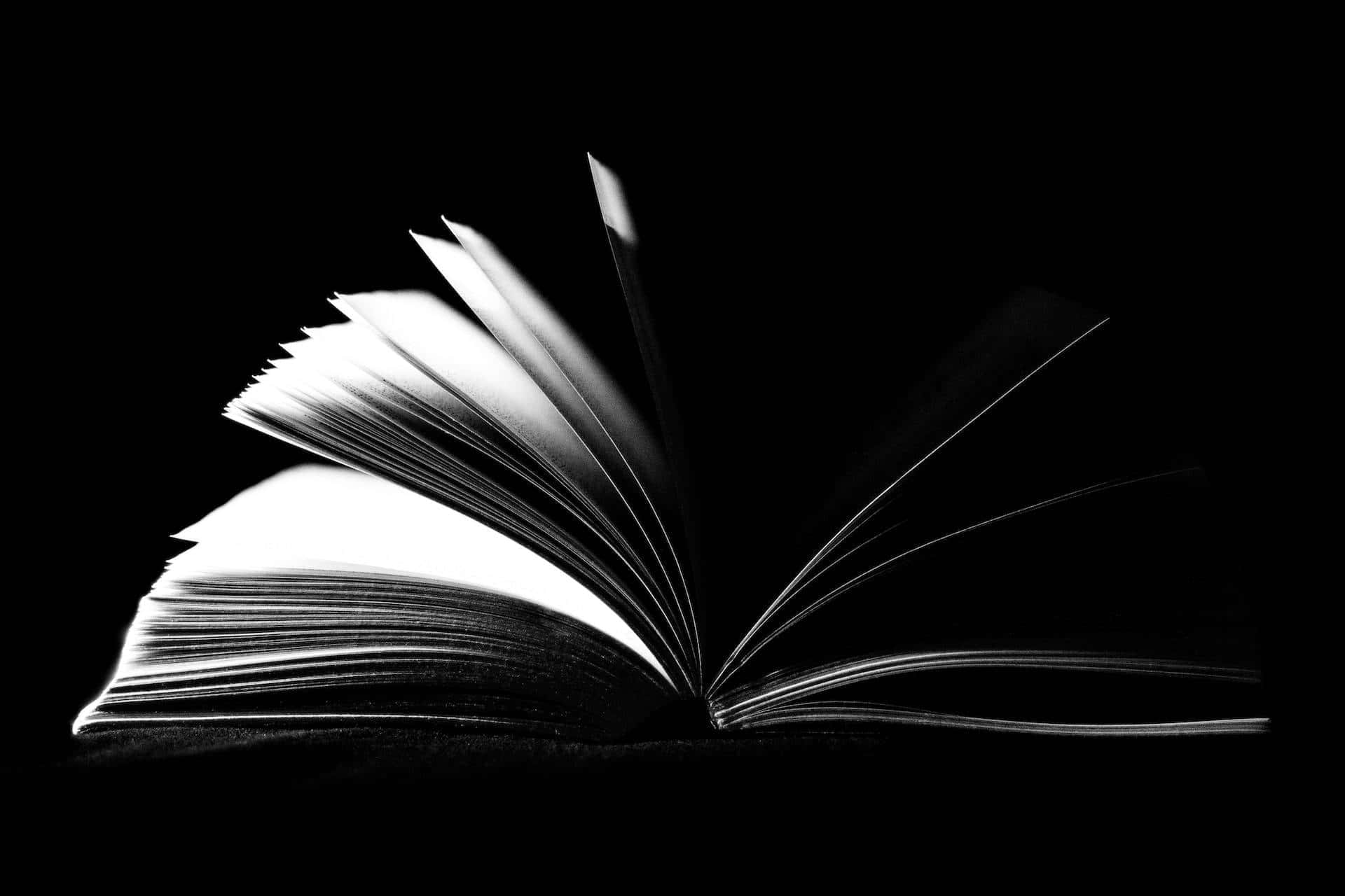 Mysterious_ Open_ Book_ Black_ Background Wallpaper