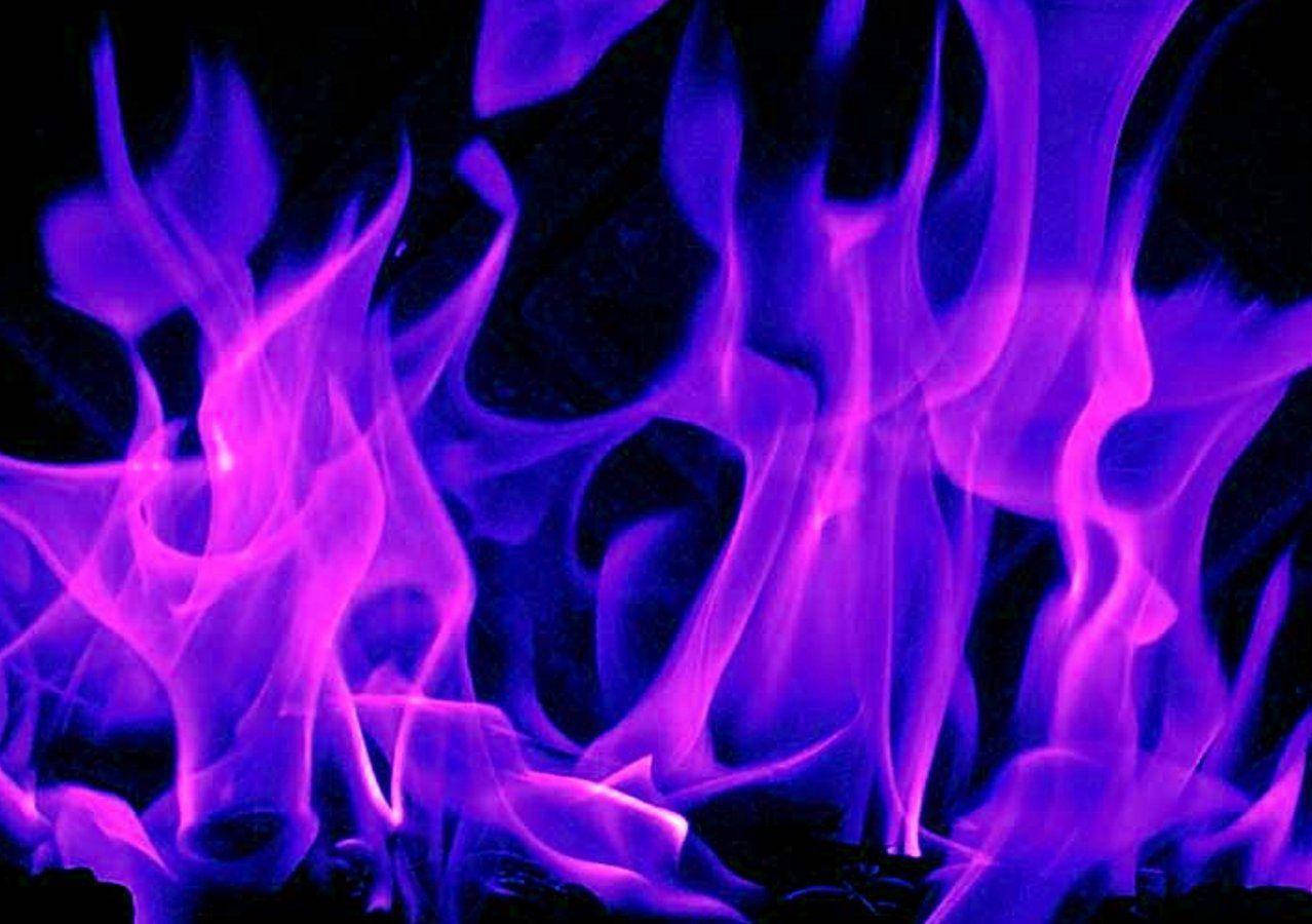 Mysterious Purple Fire Illuminating The Dark Night Wallpaper