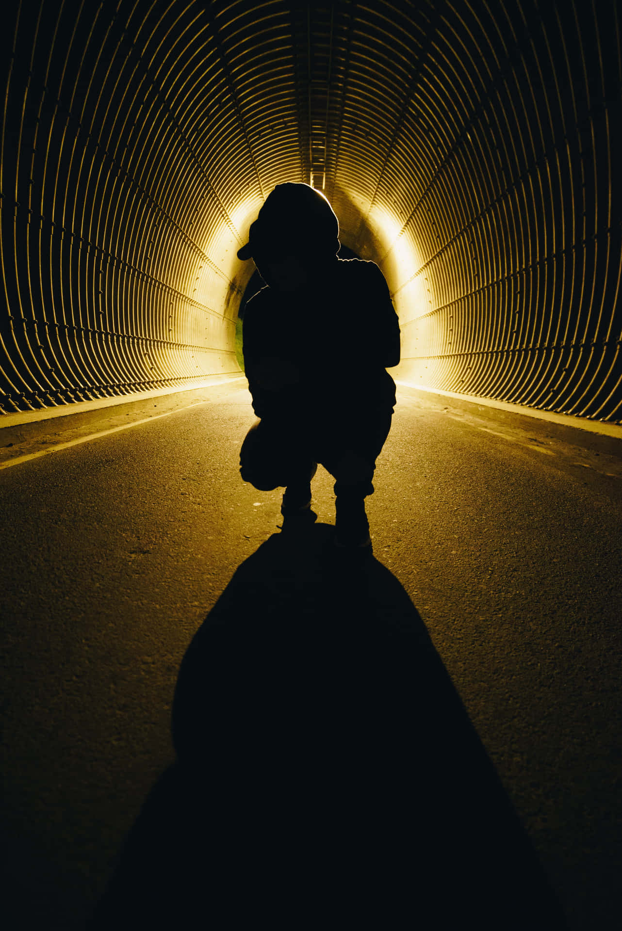 Mysterious Shadow On A Dimly Lit Street Wallpaper