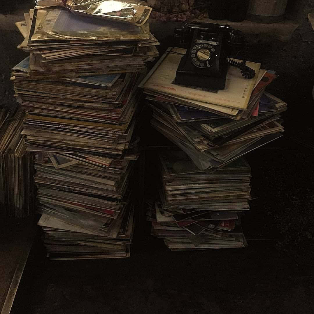 Mysterious_ Stacks_of_ Books_and_ Rotary_ Phone Wallpaper