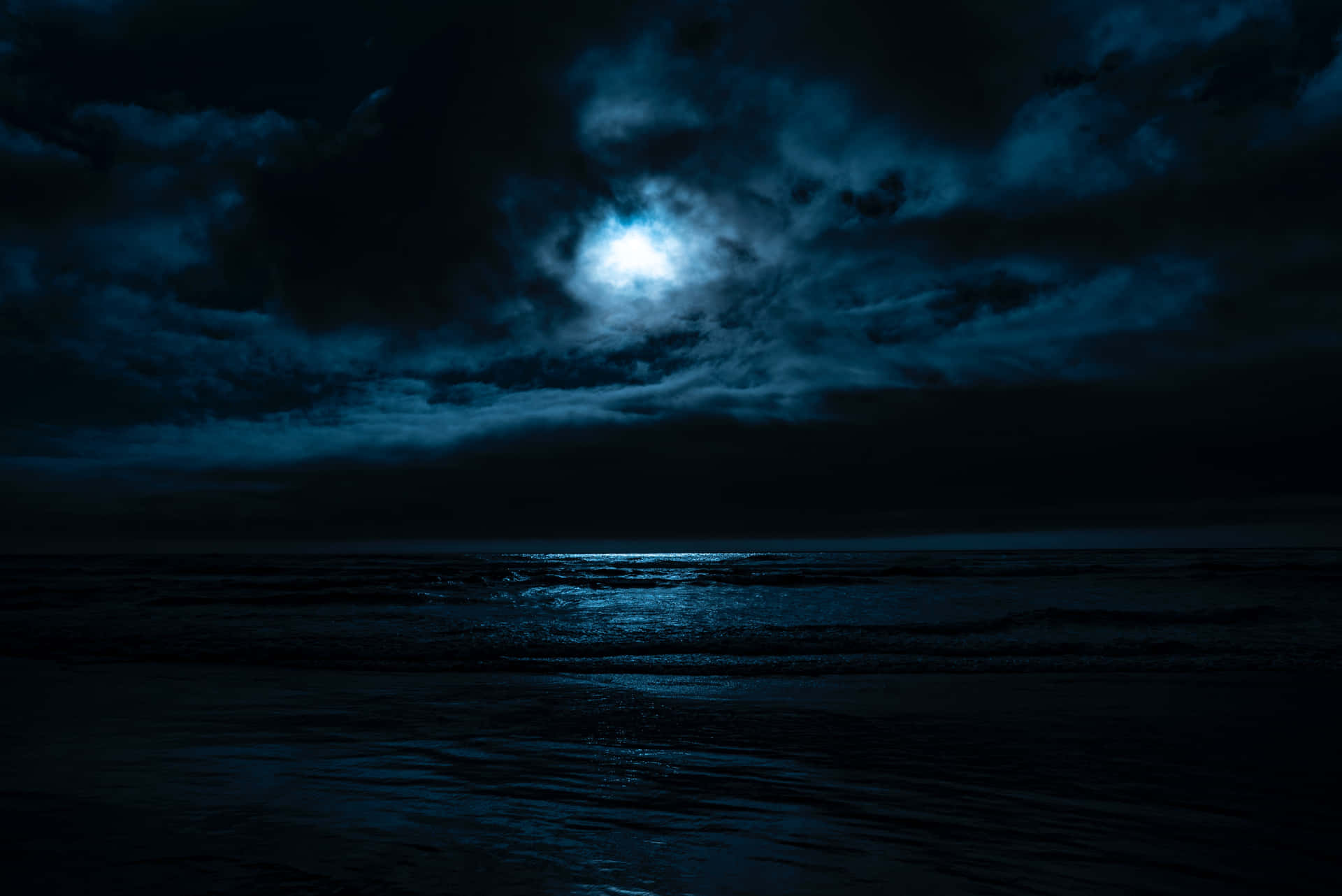 Mystical Moonrise Over Ocean Wallpaper