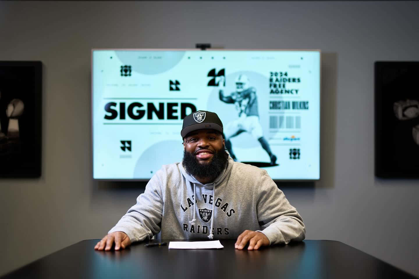 N F L Player Signing Contract Las Vegas Raiders Wallpaper