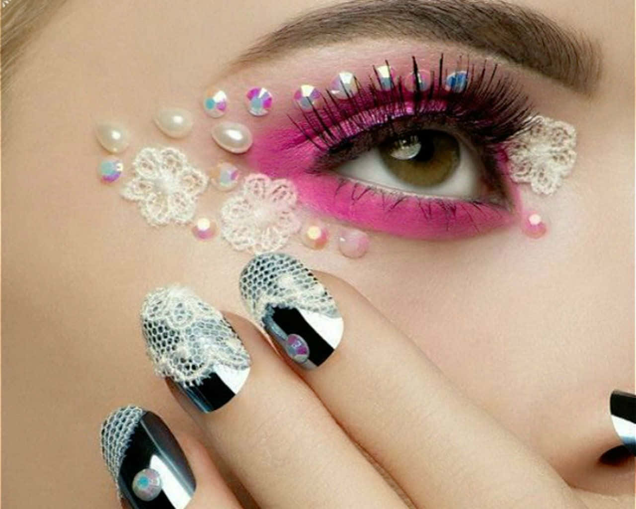 A Woman With Pink And White Nails And Lace