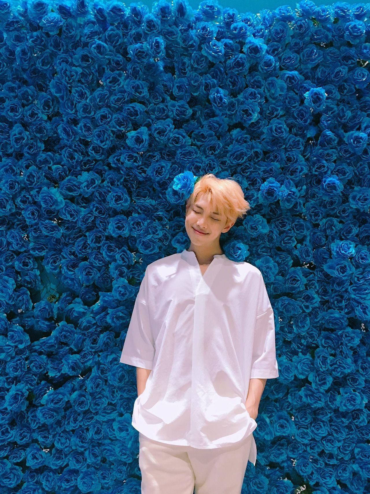 Namjoon Poses With Blue Roses Wallpaper